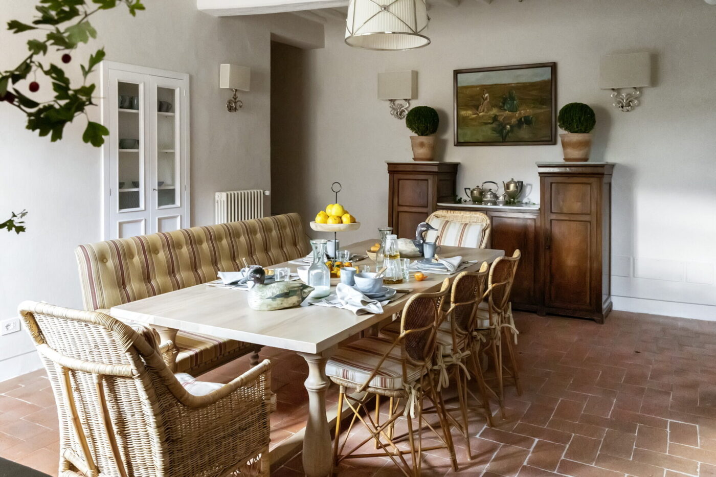 a large marble outdoor dining room table at La Chiocciola with a booth seat on one side
