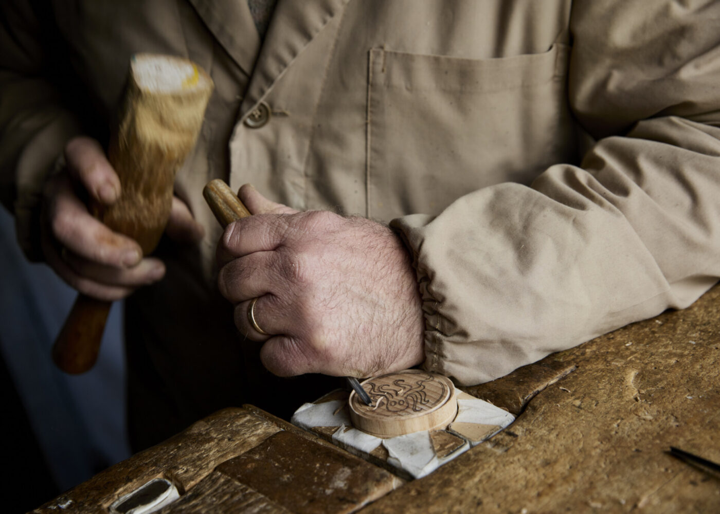 Filippo Romagnoli hand carving wooden stamps for corzetti pasta