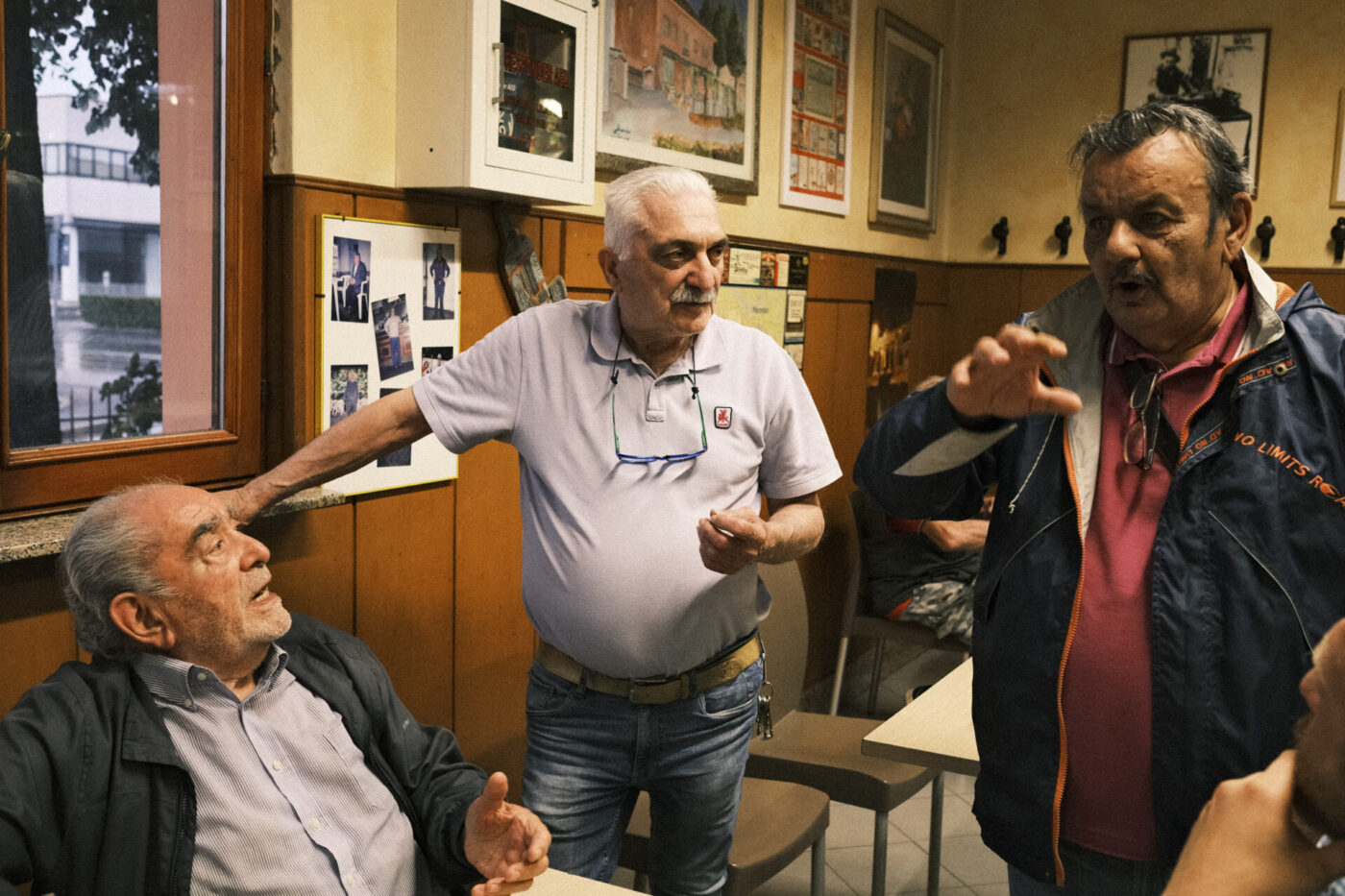 Gianni, Renzo, and il Tato standing around the cooperative