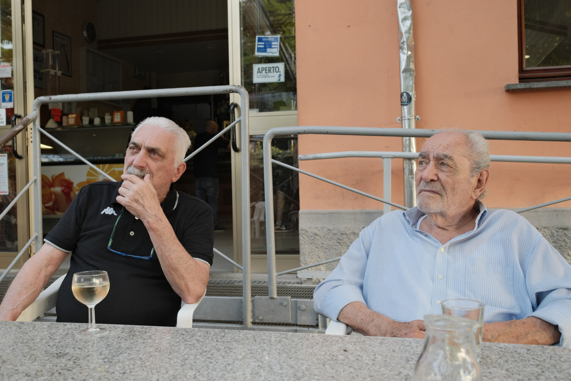 Renzo and Gianni sitting at the cooperative