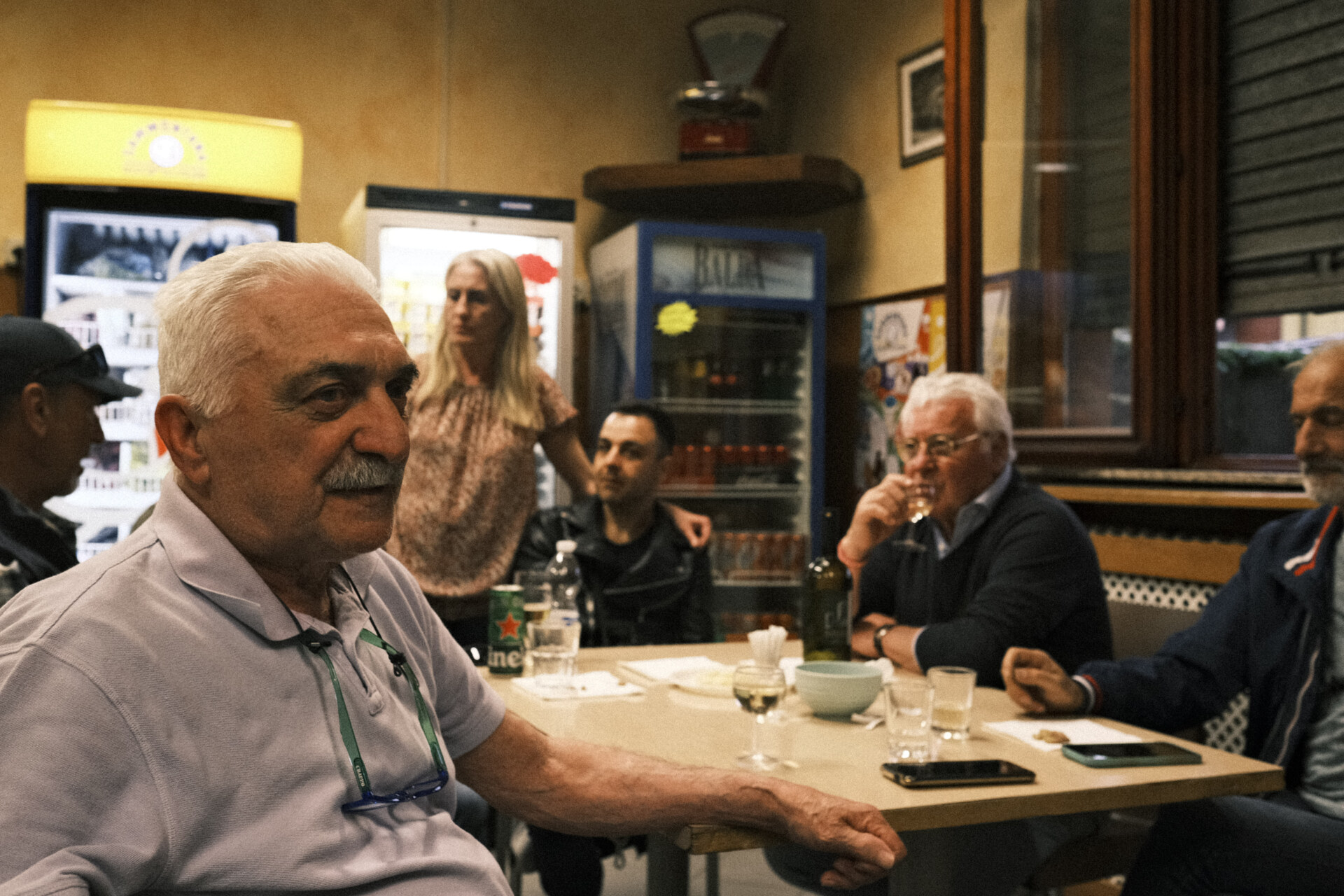 an image of old men sitting at the cooperative