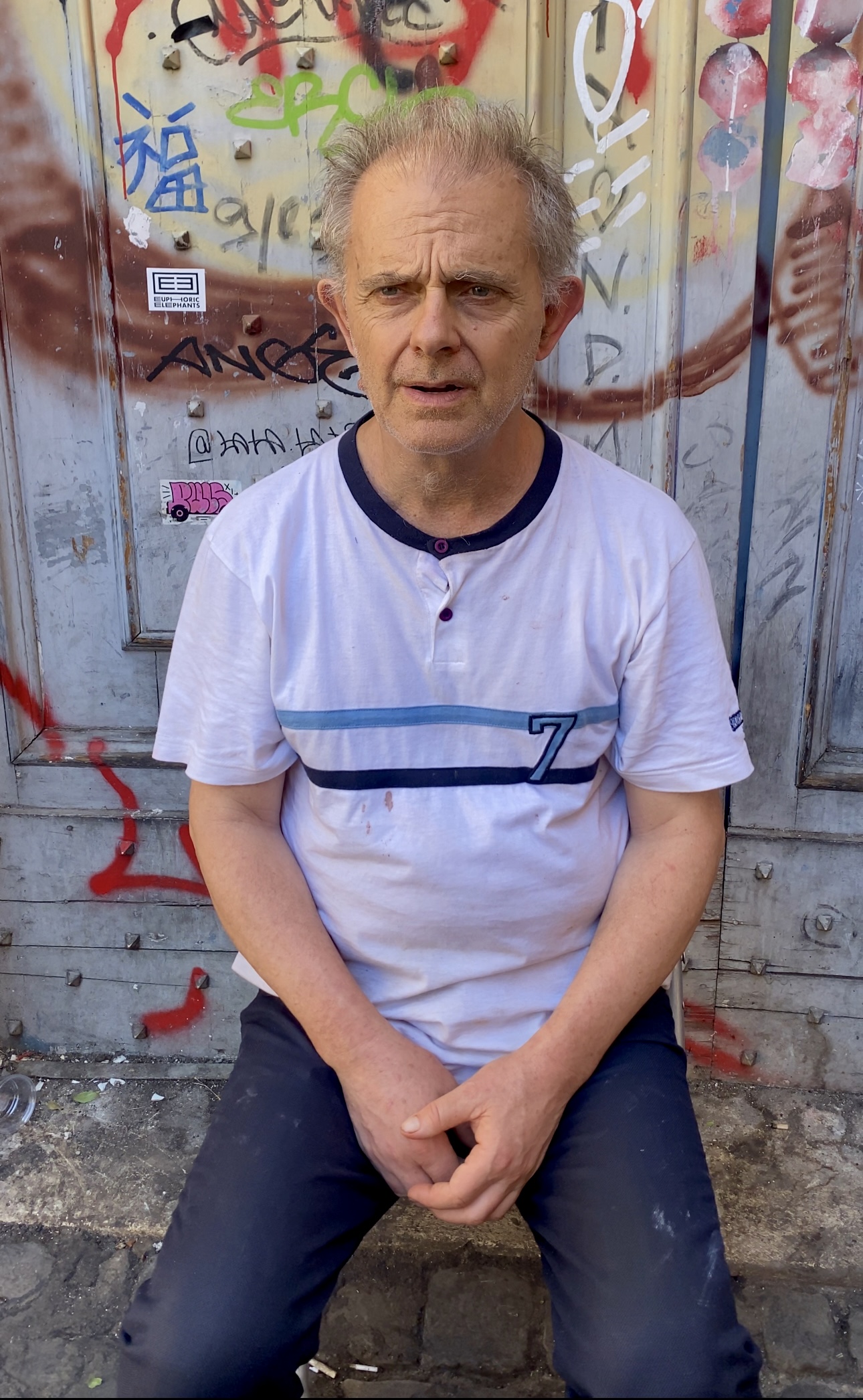 an elderly man sitting