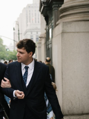 an image of Giacomo Bertoldi walking in new york wearing a suit