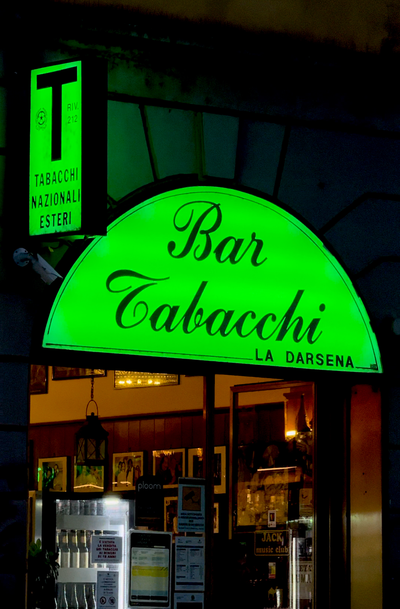 the bright green sign of a tabaccheria