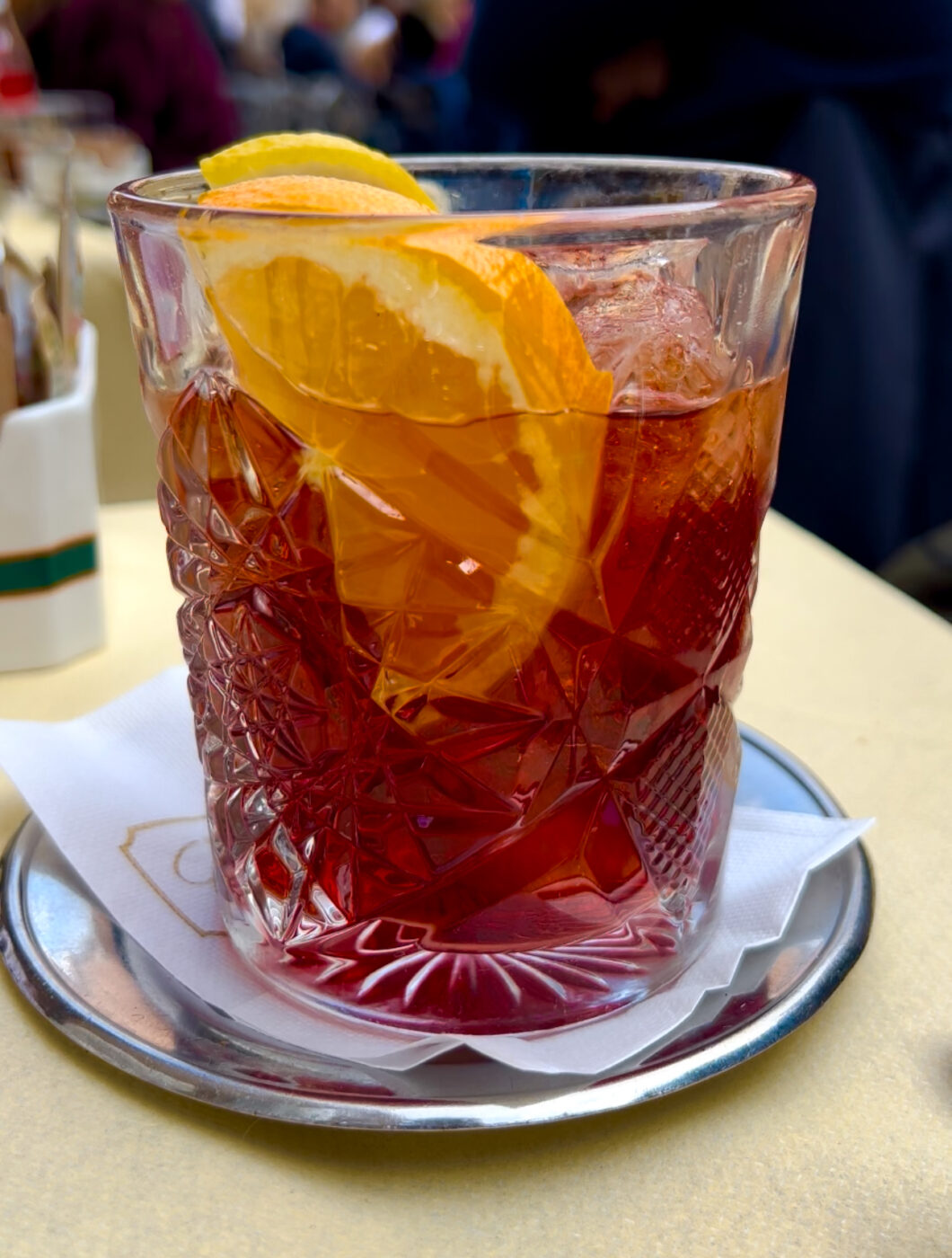 a dark red negroni at aperitivo in milan