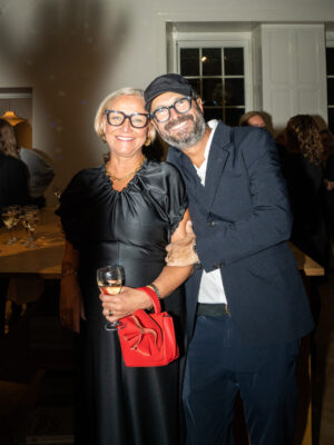 Maj-la and claudio pizzelli of atp atelier hugging at an event