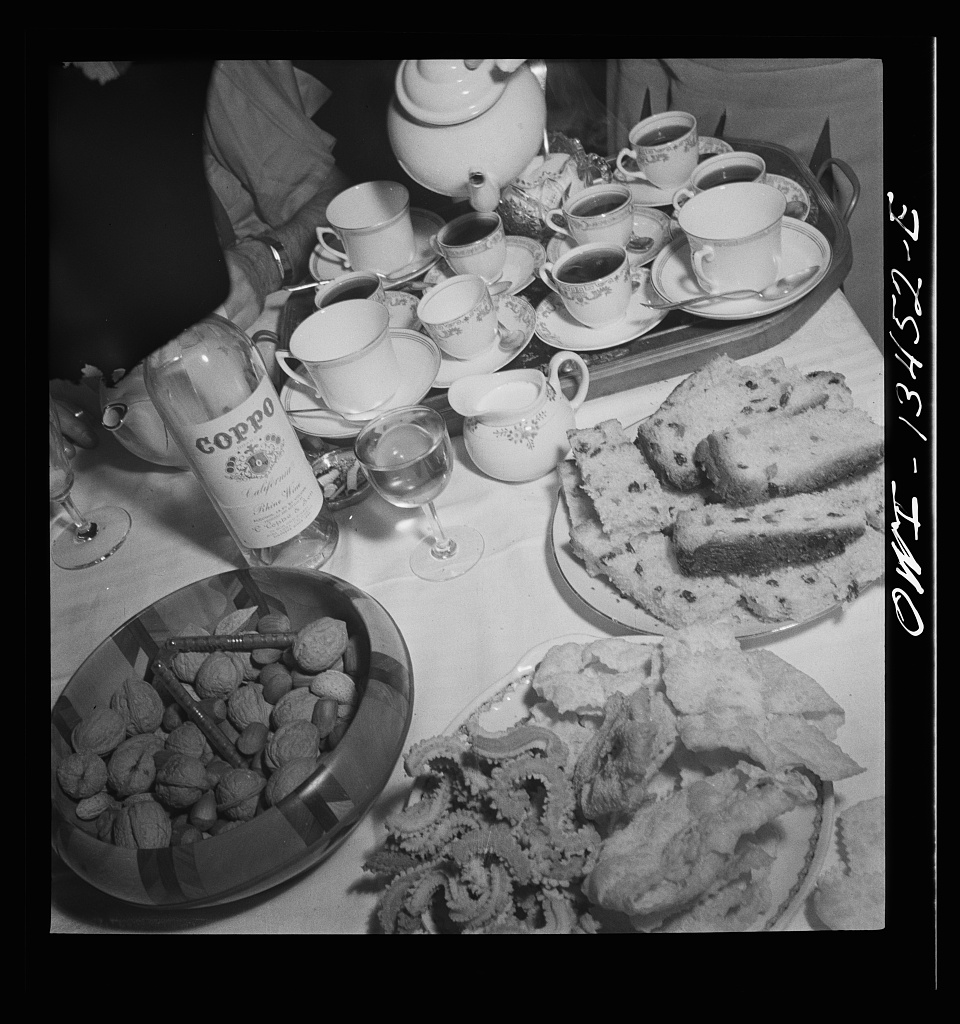 a vintage black and white image of sunday dinner at the martinetti home
