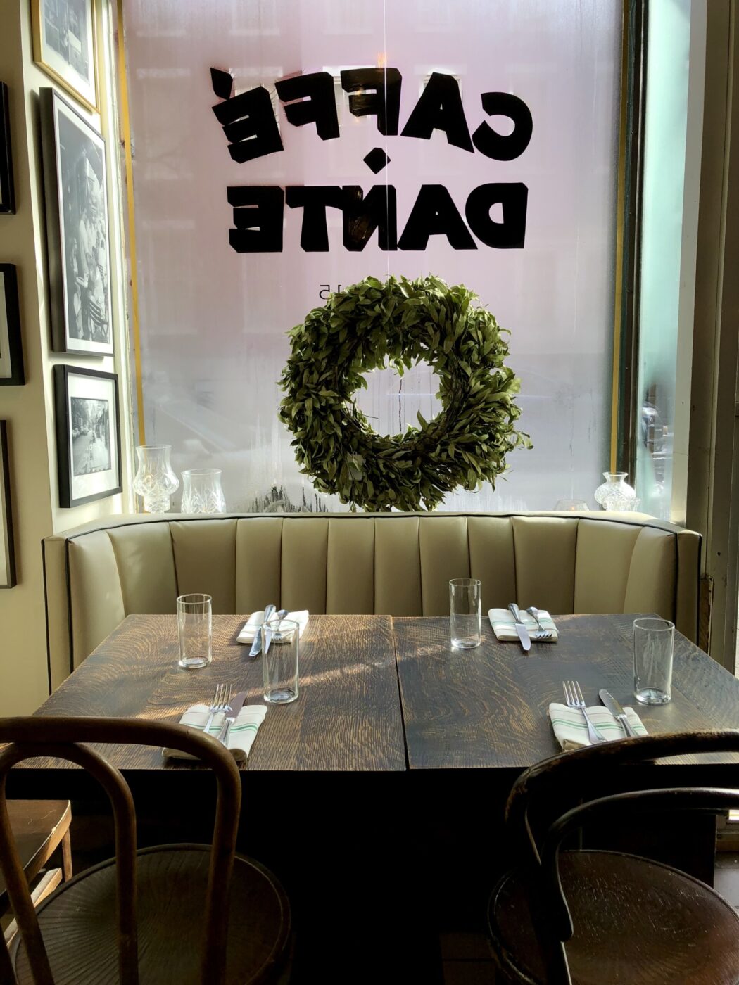 a table tucked against a window covered in condensation at caffe dante in nyc