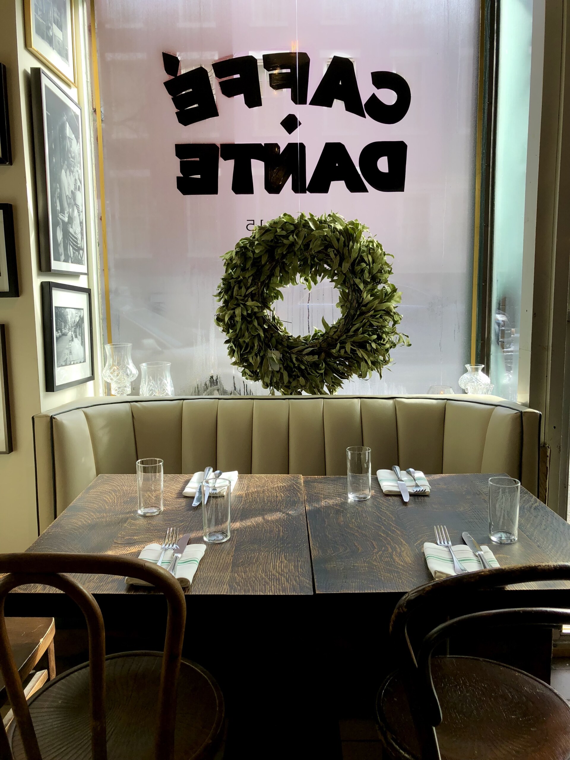 a table tucked against a window covered in condensation at caffe dante in nyc