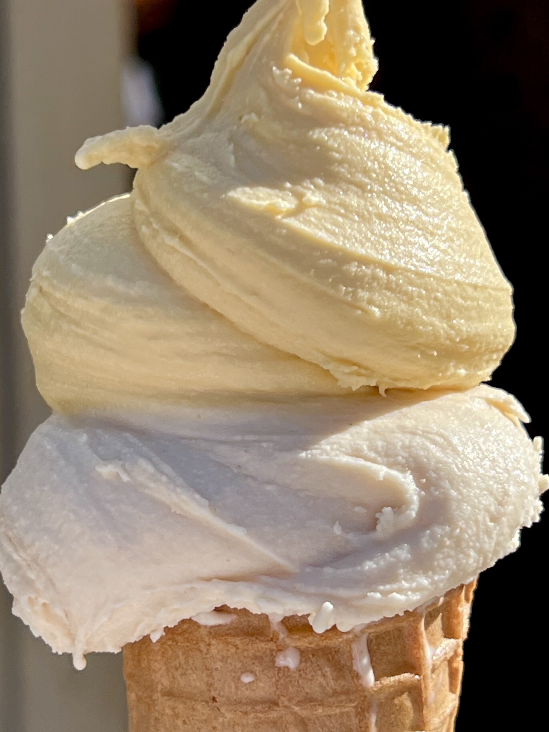 two scoops of gelato on a cone from Gelateria Gentile