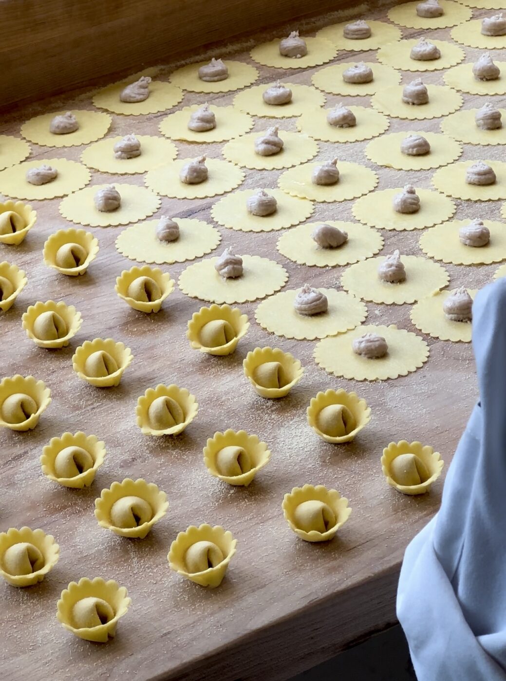 lines of tortellini being handmade in the window at misi pasta