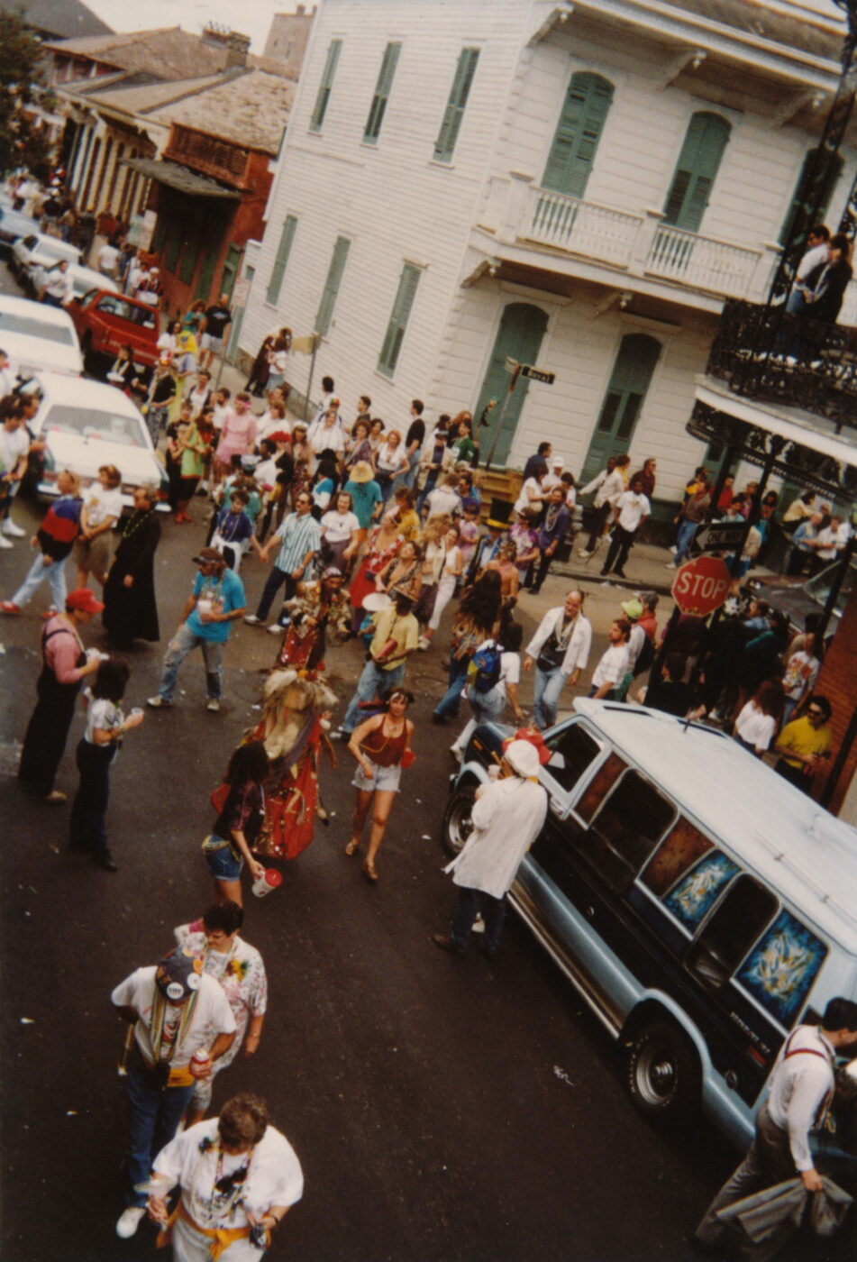 A vintage image of floats and a crowd of people on Mardi Gras Day 1992 in New Orleans