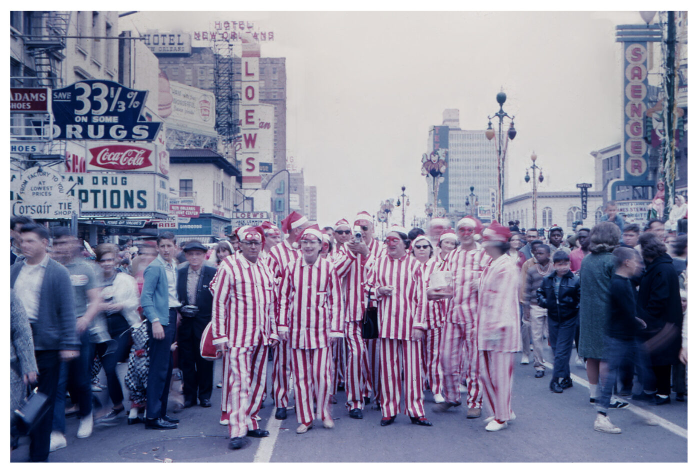 New Orleans 1965 Mardi Gras Costumers on Canal Street wearing red and white striped suits
