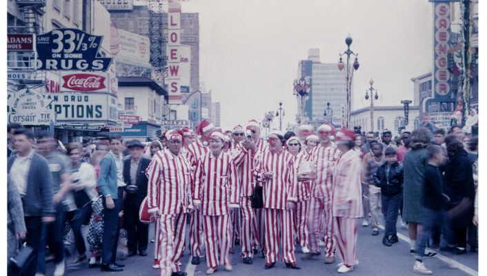 New Orleans 1965 Mardi Gras Costumers on Canal Street wearing red and white striped suits