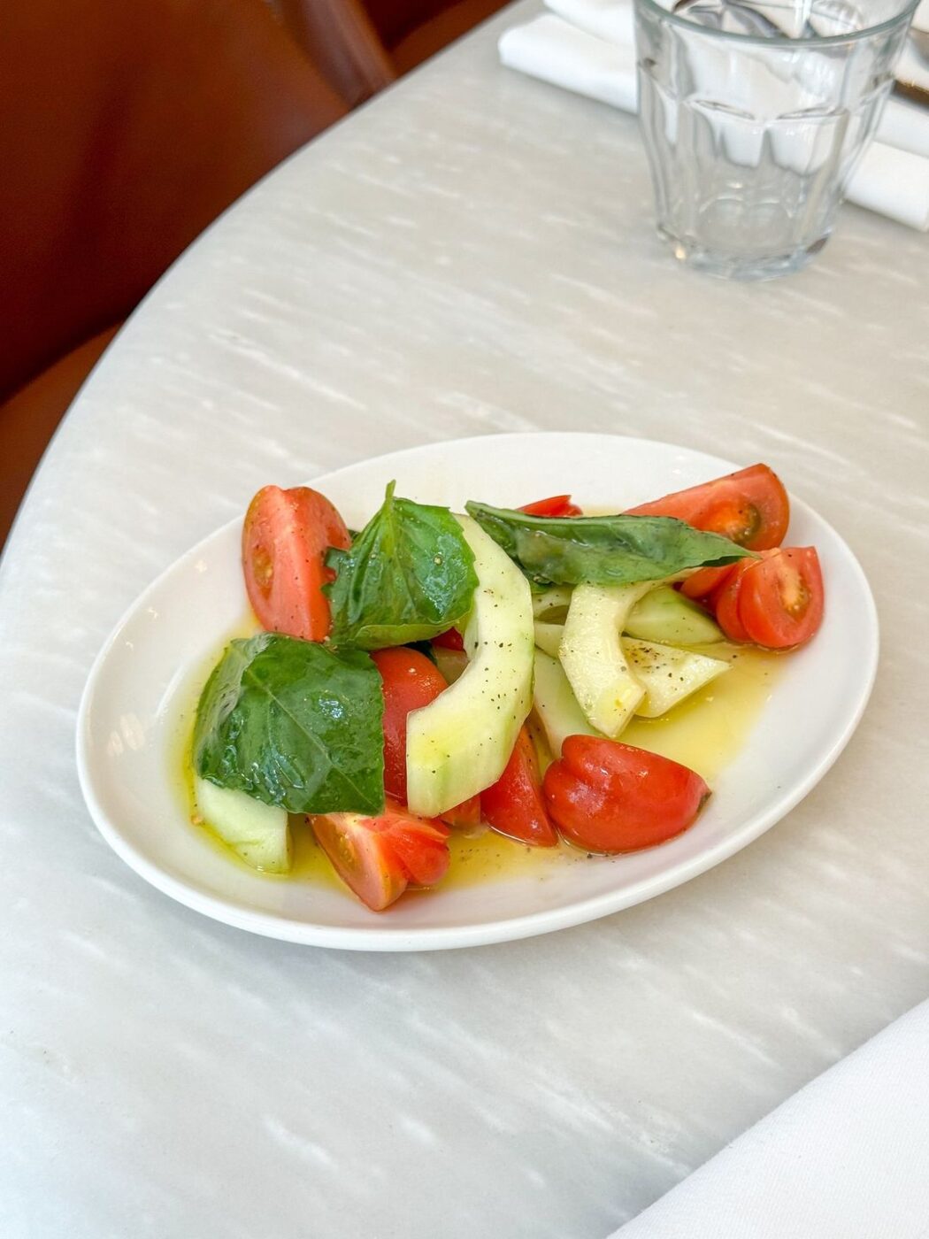 Sicilian marinda tomatoes and Puglian carosello cucumbers with basil and white balsamic from Bocca di Lupo