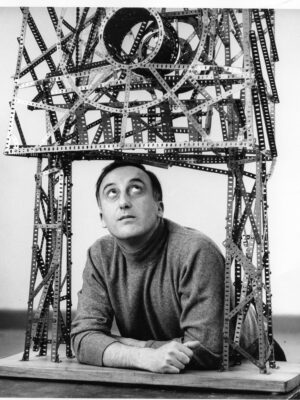 a black and white image of Enrico Baj from 1964