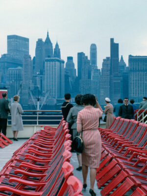 vintage image of people on the staten island ferry with a view towards downtown manhattan