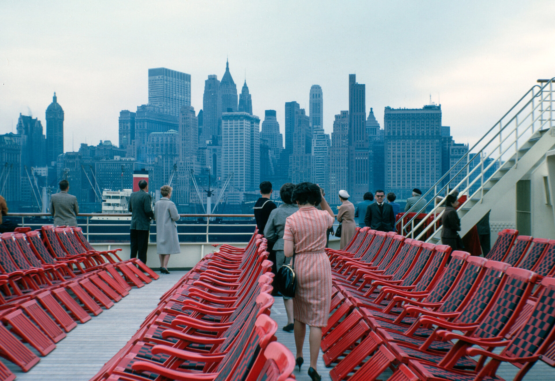 vintage image of people on the staten island ferry with a view towards downtown manhattan