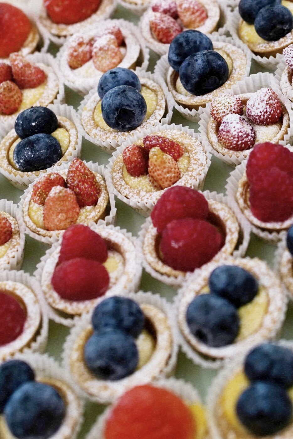 a close up image of an assortment of tarts and pasticcini from marchesi