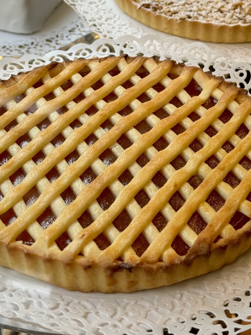 a large, round, perfectly symmetrical crostata