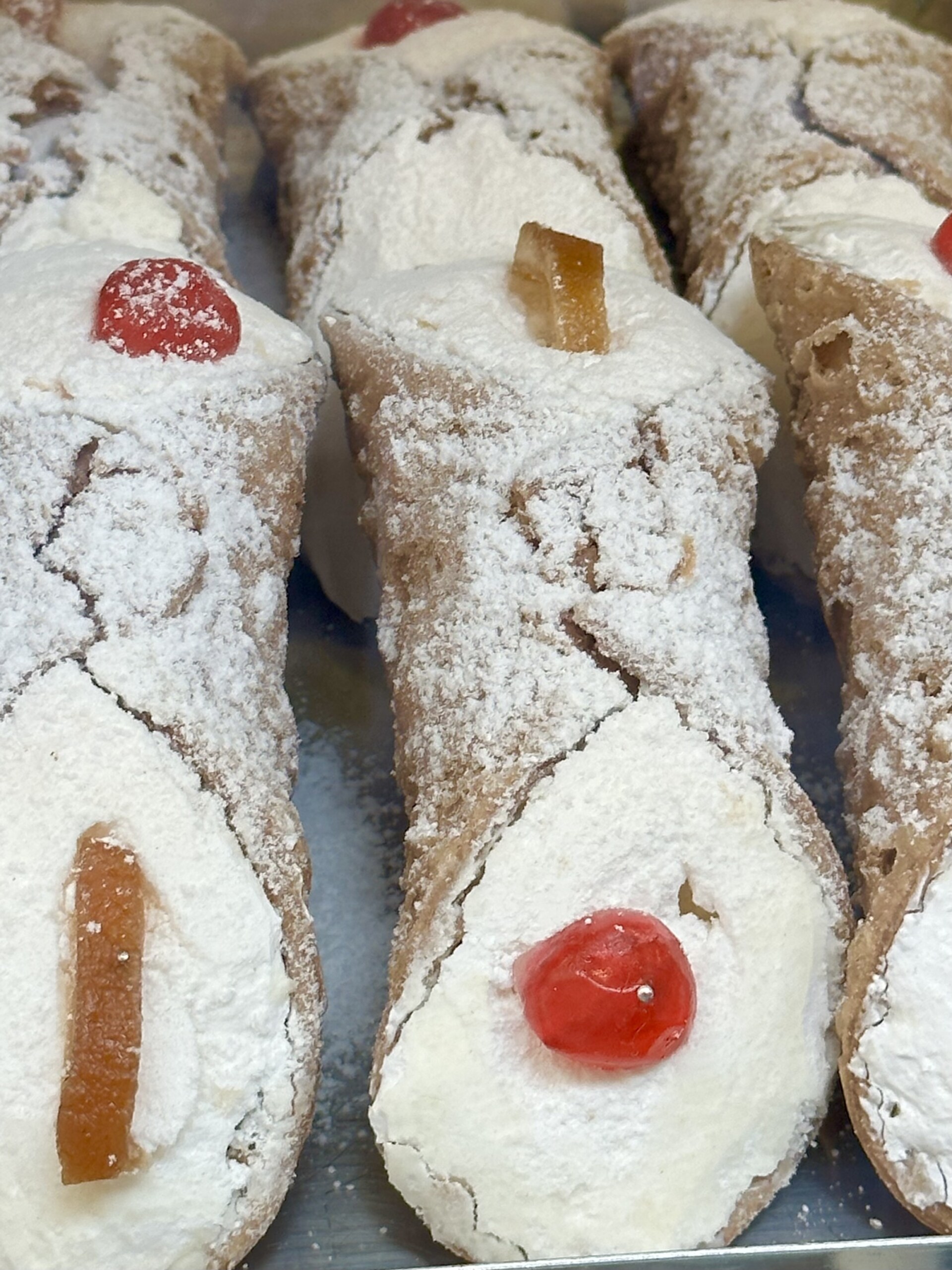 a close up image of cannoli