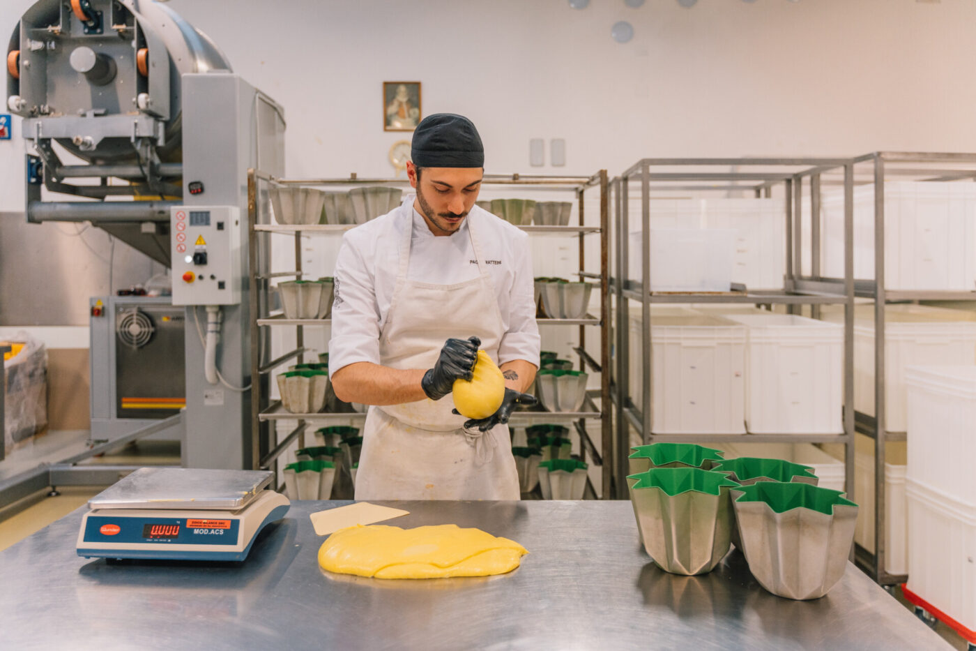 a baker at olivieri making pandoro