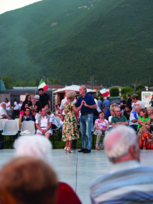 a couple dancing at the festa del cacciatore in lombardy