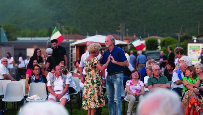 a couple dancing at the festa del cacciatore in lombardy