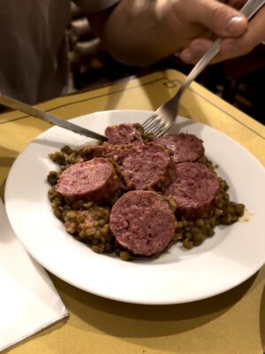a plate of zampone on lentils in Italy
