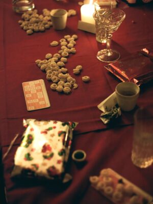 Tavola di natale, christmas table in italy set with tortellini and playing cards and gifts