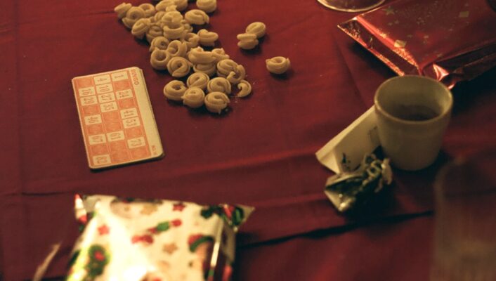 Tavola di natale, christmas table in italy set with tortellini and playing cards and gifts