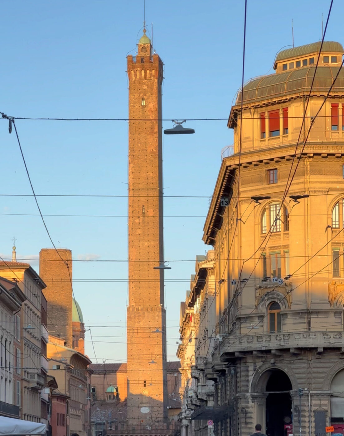 the asinelli tower in Bologna at sunset