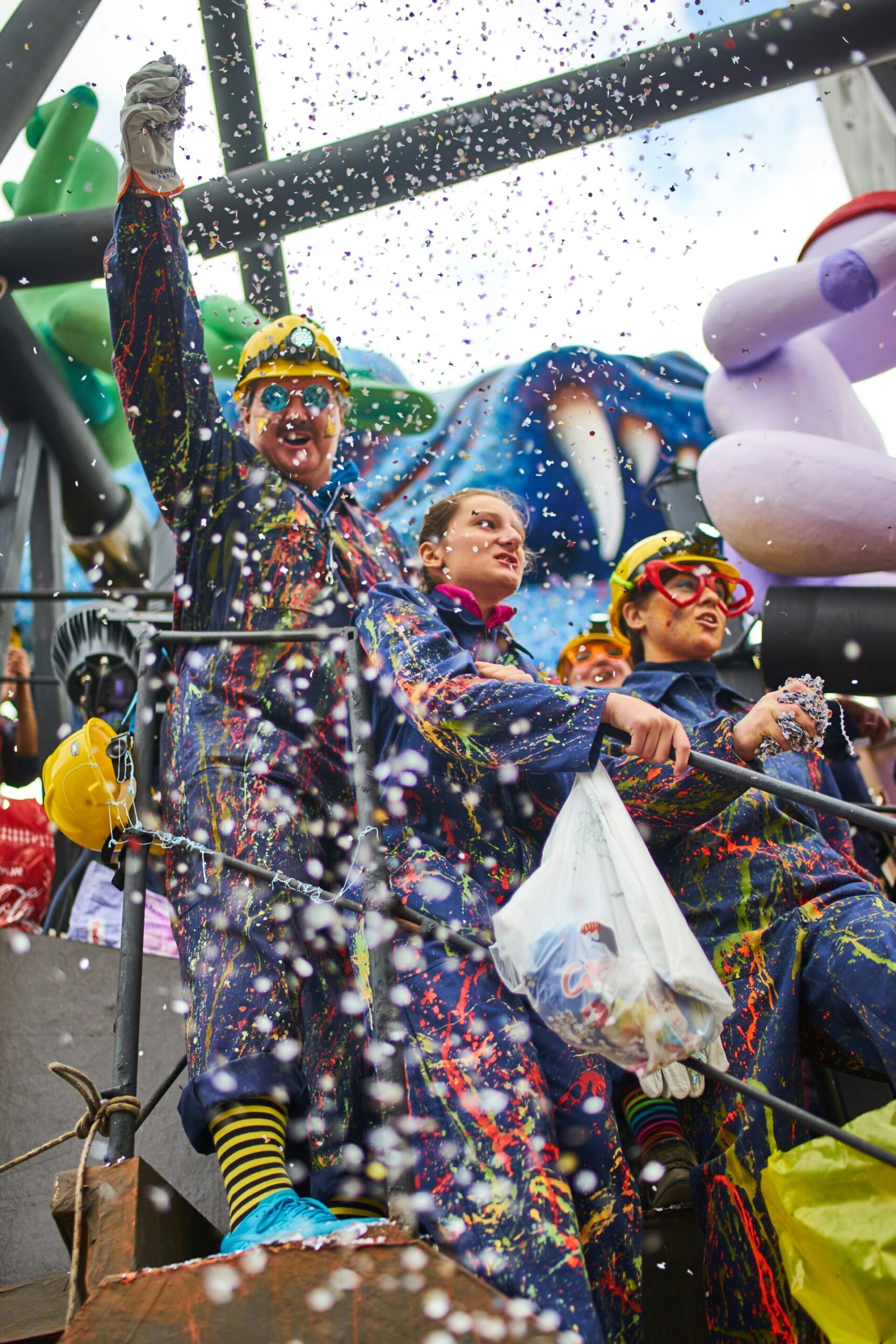 a float at venice's carnevale with confetti being thrown down
