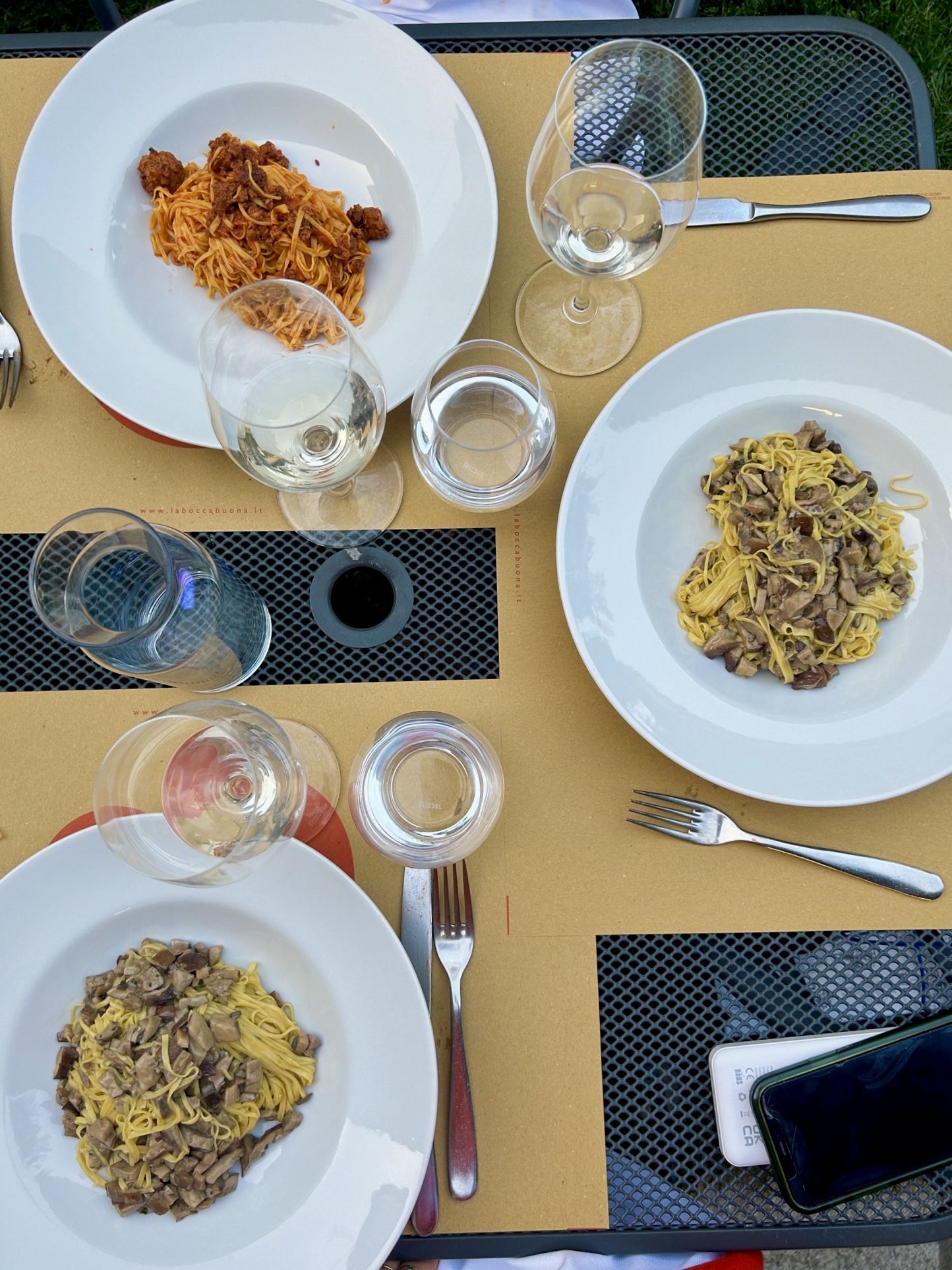an overhead image of plates of tajarin from Osteria La Bocca Buona