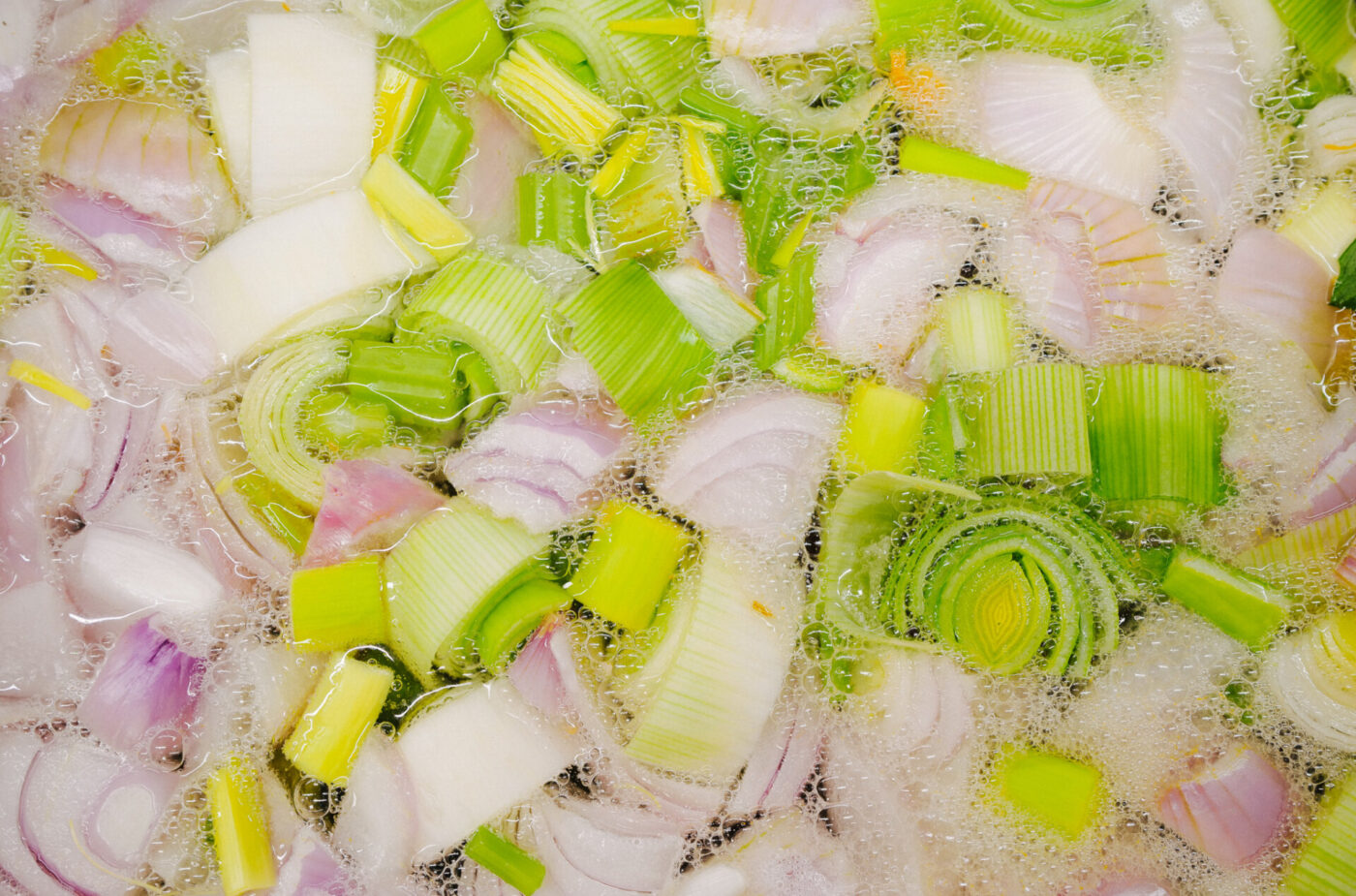 onions and leeks cooking for saffron risotto