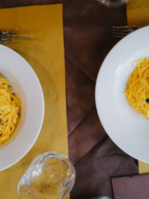 two bowls of thin tajarin at a restaurant in turin