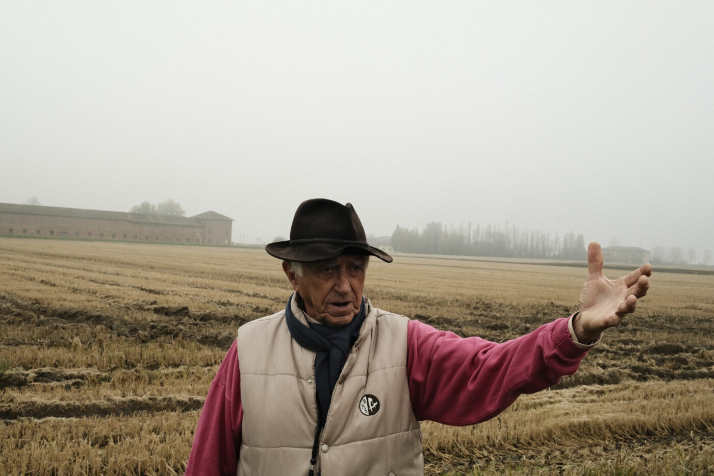 a man showing his rice paddies in vercelli