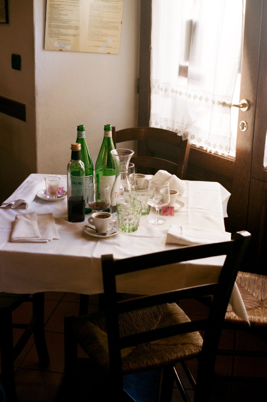 a rustic tuscan table at the end of a meal