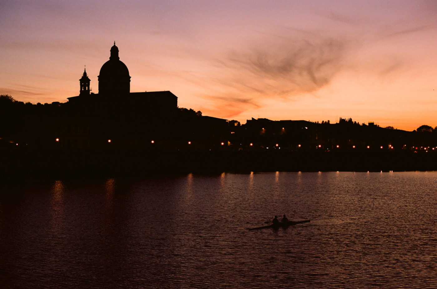 winter sunset over the arno river in florence