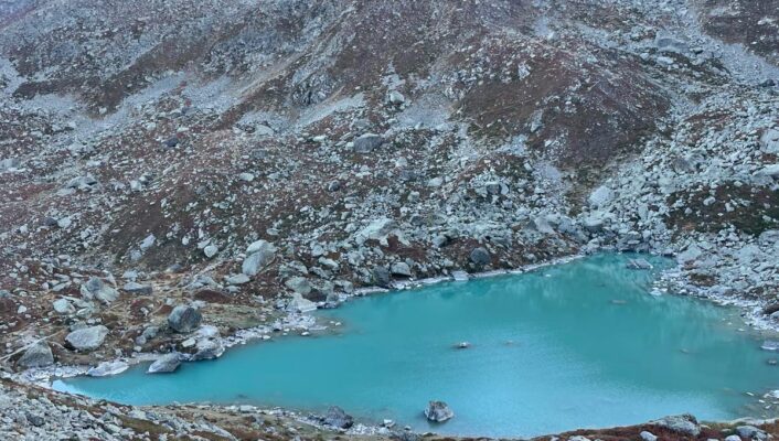 a bright blue lake below monviso