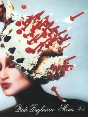Mina's album Ridi Pagliaccio Mina Vol. 1/2 - A woman with dramatic makeup poses with her eyes closed. Her hair is styled into an extravagant cake-like shape decorated with candles and cherries. Text at the bottom reads Ridi Pagliaccio Mina Vol. 1/2.