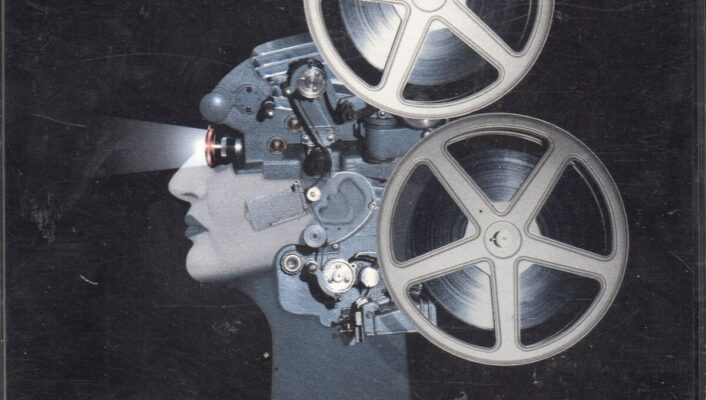 Sorelle Lumière Vol. 1/2 - A surreal cover for Sorelle Lumière Vol. 1/2 by Mina features a human head with mechanical elements, resembling a projector. Film reels replace the brain, projecting light from the eyes. The background is dark and minimal.