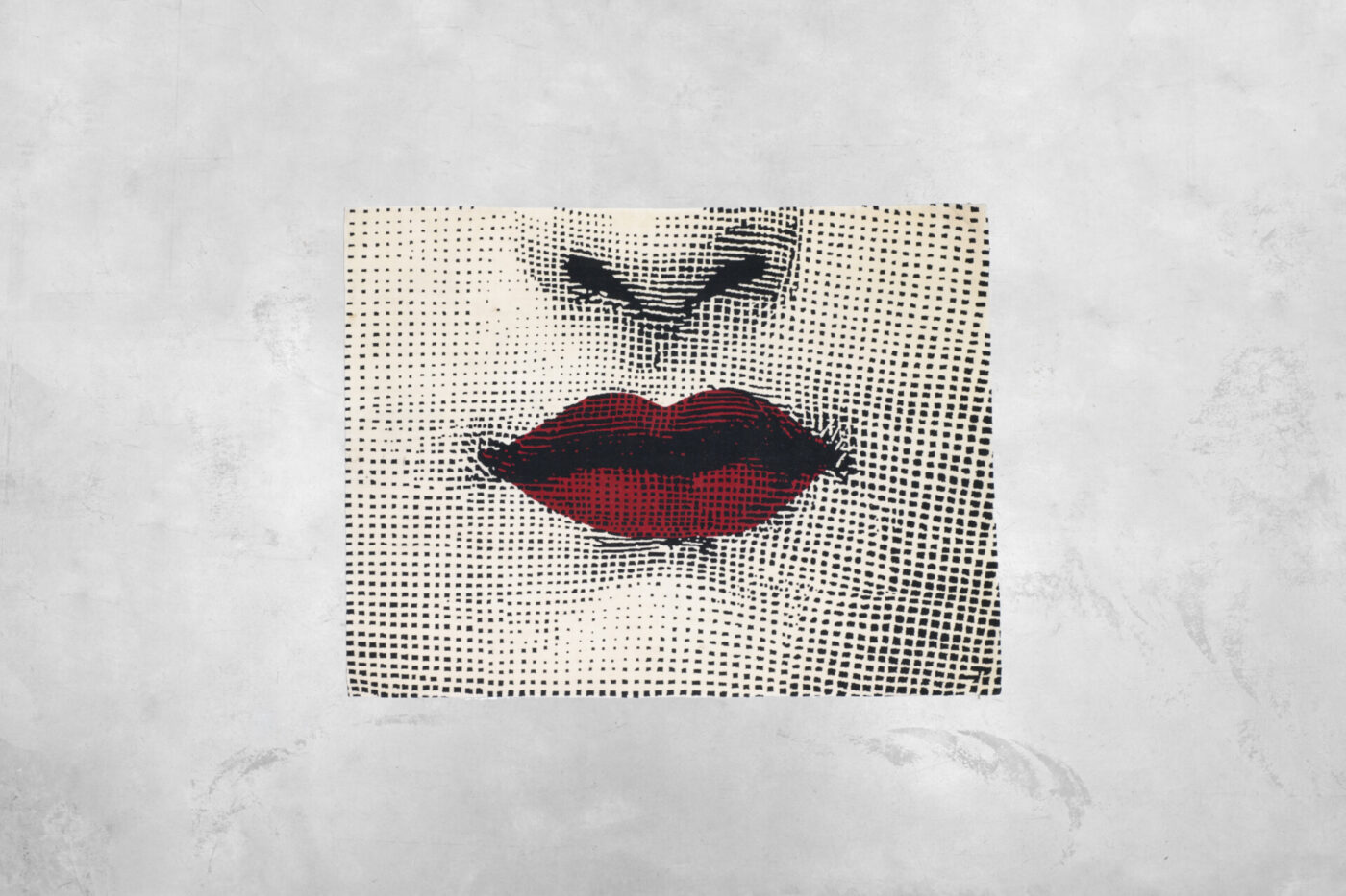 "Il Bacio" by Barnaba Fonasetti - Artistic depiction of a face focusing on the lips and nose using a halftone effect. The lips are vivid red while the rest of the face is dotted with black on a white background.