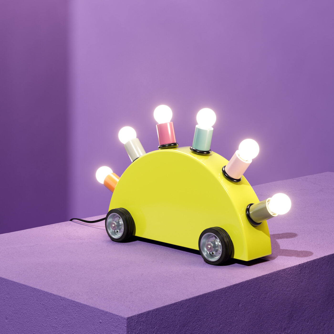 Super lamp - A yellow, toy-like lamp shaped like a car with wheels. It has colorful light bulbs on top, resembling spikes. The lamp sits on a purple surface against a purple background.