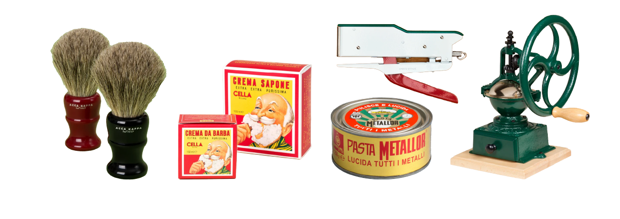 Two shaving brushes, red and yellow shaving soap boxes featuring a man's illustration, metal polish tin, stapler, and green grinder on white.