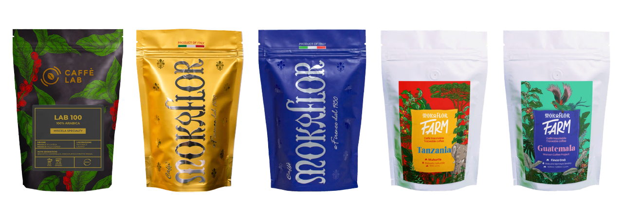 Five colorful coffee bags are lined up, each with distinct designs and branding in bright yellow, blue, green, and white patterns.