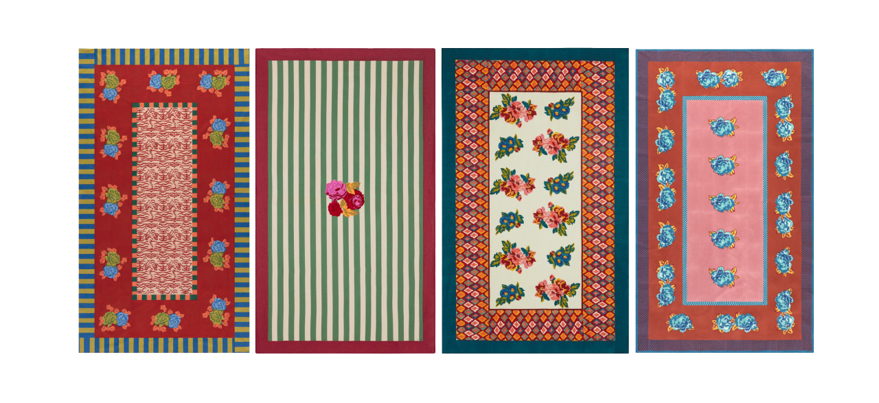 Four vibrant rectangular rugs with floral, striped, and geometric patterns in red, green, blue, and pink are shown side by side.