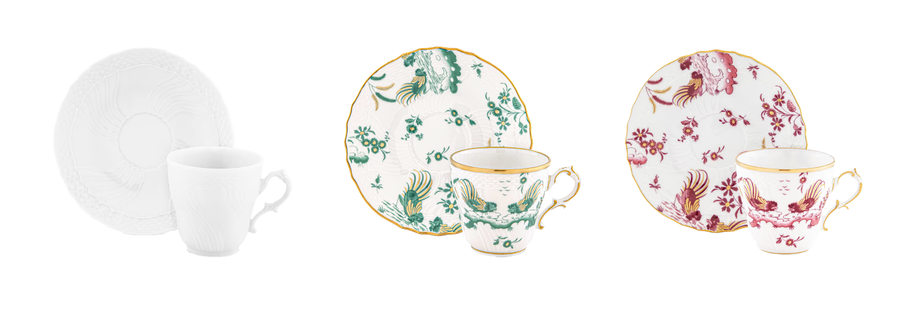 Three teacup and saucer sets—plain white, green and gold floral, red and gold floral—side by side on a white surface.