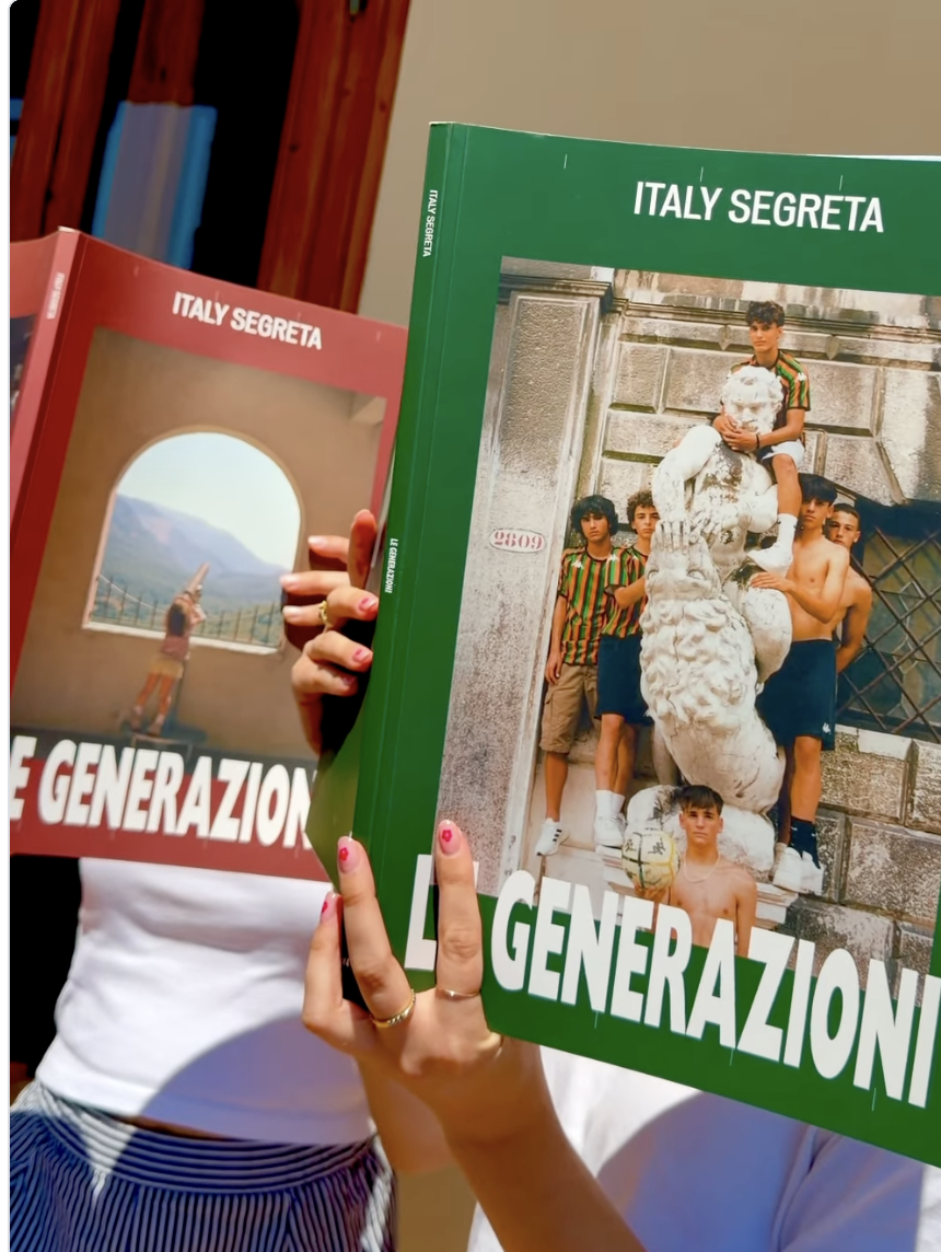 Two individuals hold up magazines showing groups of young men on the covers, using them to mask their faces so the printed faces line up with their own. One magazine is bordered in green and the other in red.